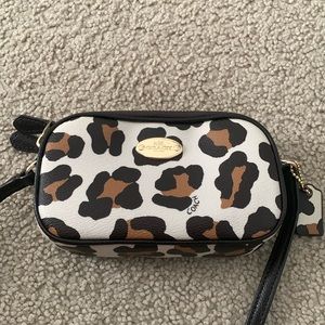 Rare Coach Ocelot mini purse with black adjustable strap.